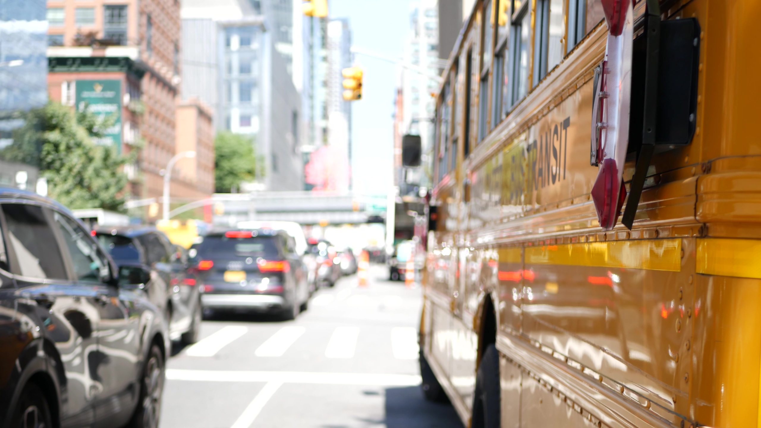 Yellow School Bus on New York Manhattan street, schoolbus truck on USA city road. Children education
