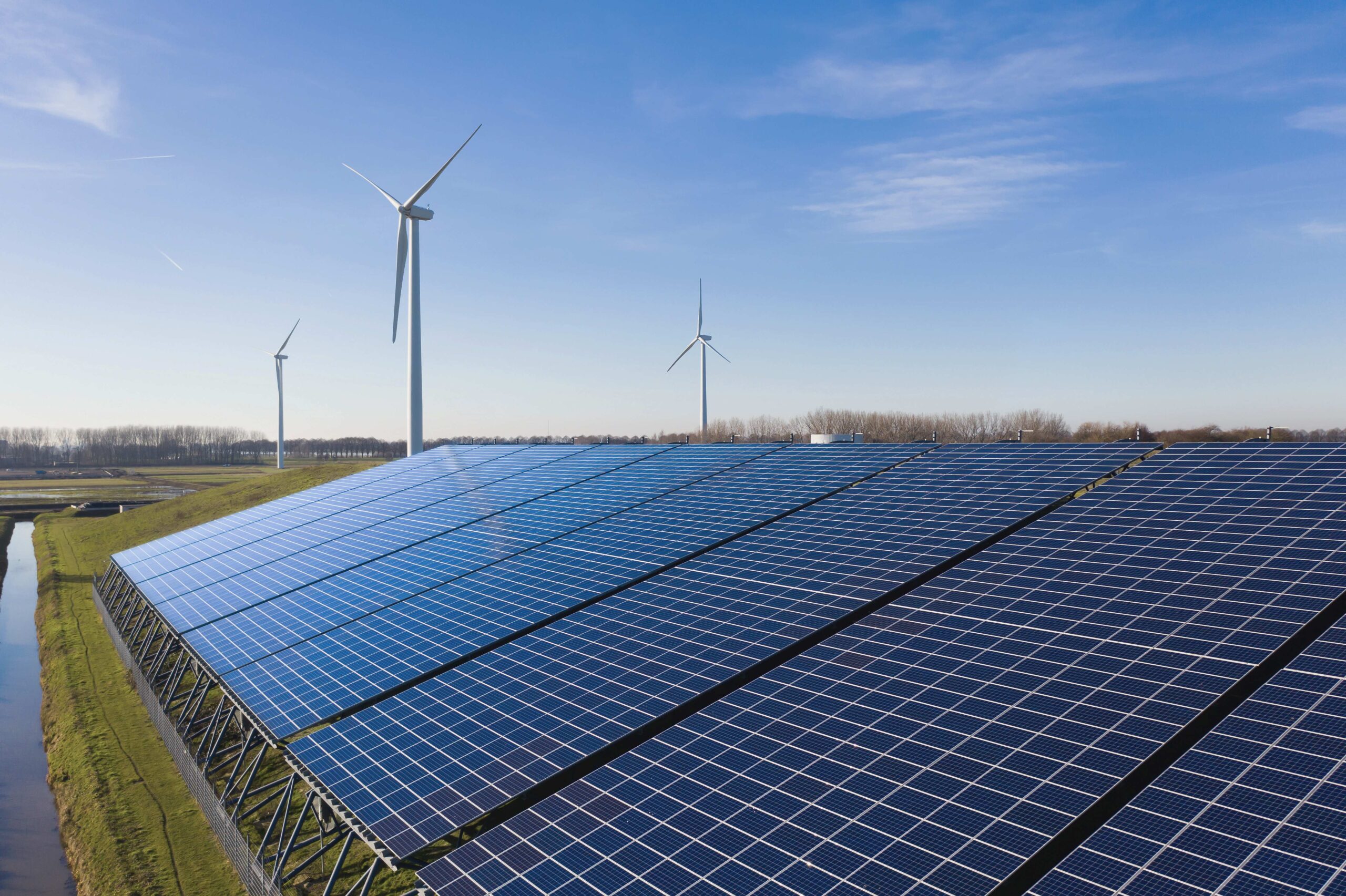 Solar panels and wind turbines generating eco friendly green ene